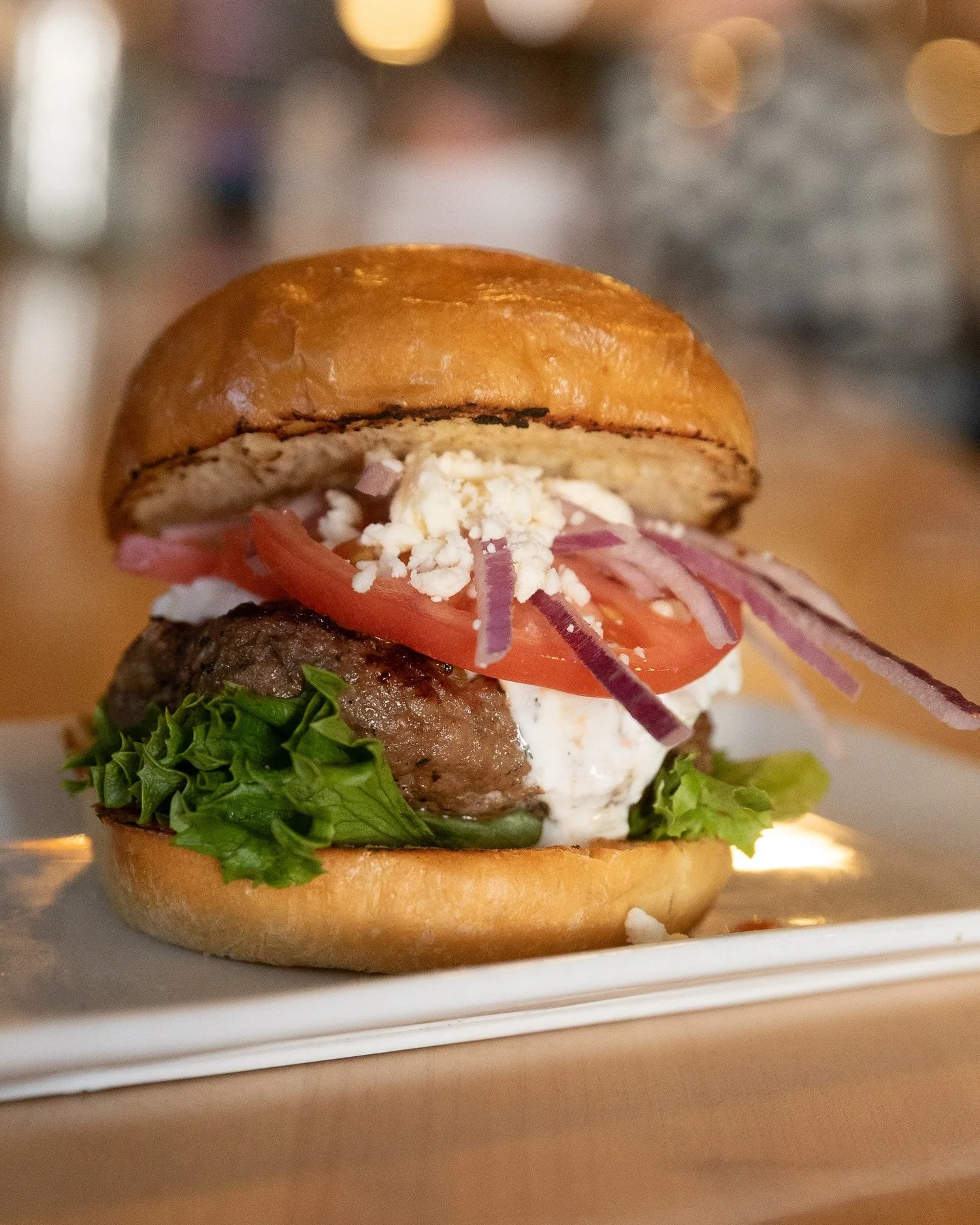 Gyro Burger
lamb &amp; beef gyro patty, red onion, tzatziki, tomato, feta, greens

One our our March Specials!