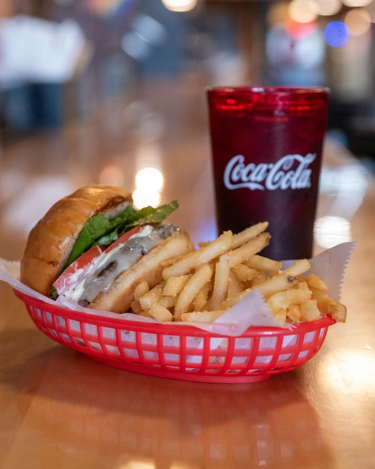 Our Burger Basket lunch special is light in the wallet and heavy on flavor. Dress it up how you want and pair with a Coca Cola for a winning combo.