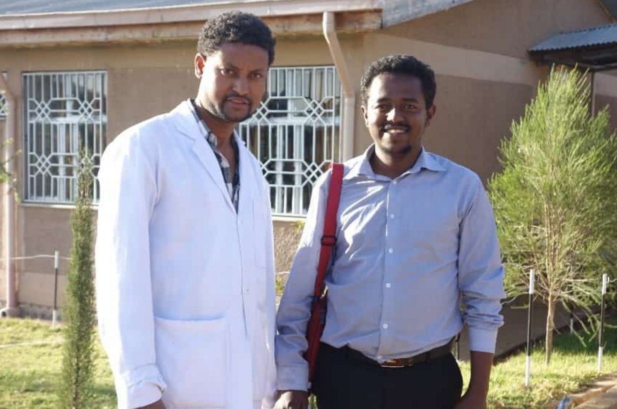 Emergency clinical officer Amsalu Tiruneh (left) and Dr. Zebenay Bitew are part of a team-approach to improving surgical services .
