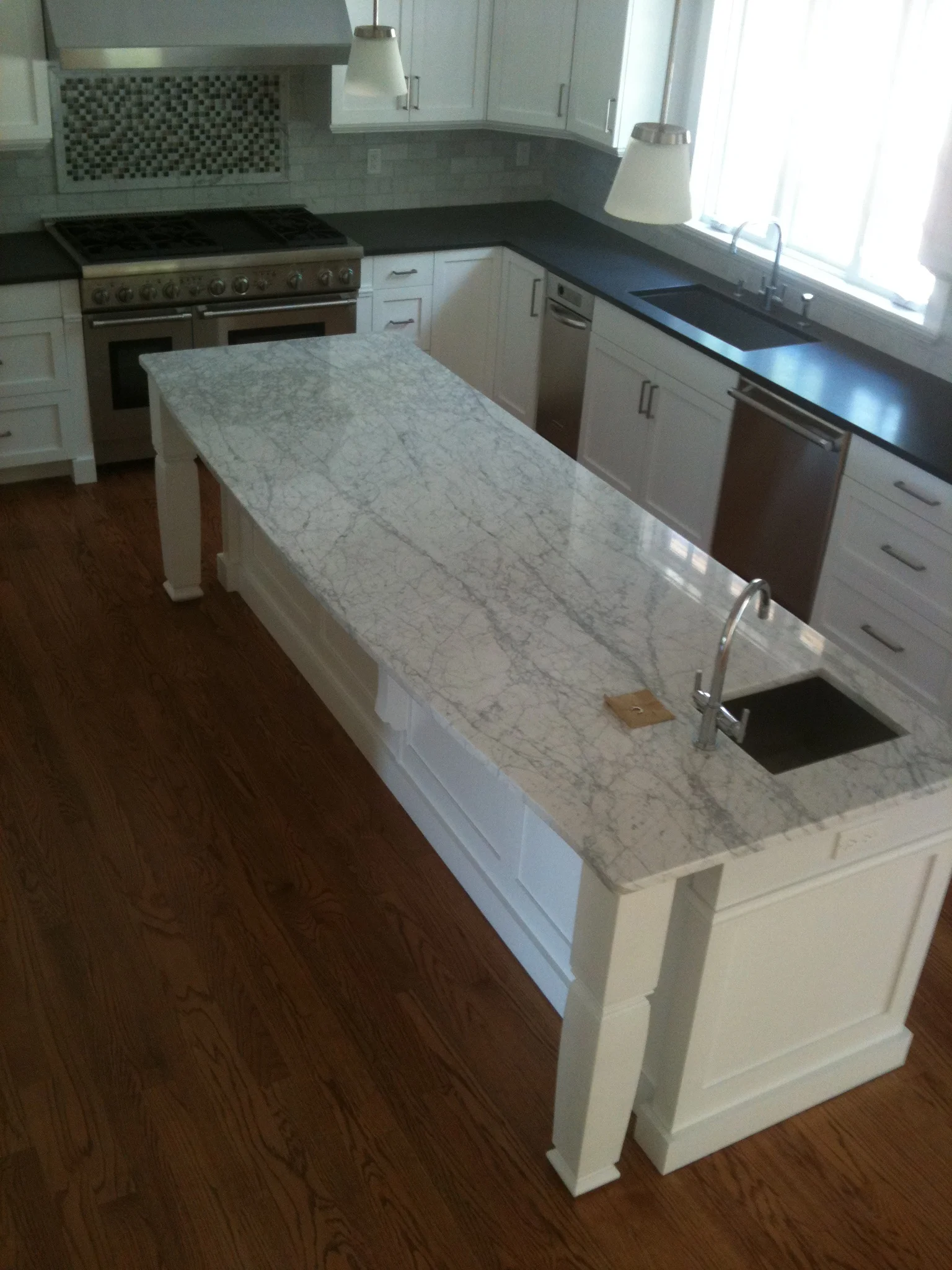 White Carrara & Raven Caeserstone Honed
