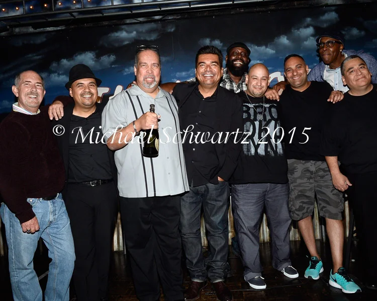(L-R) Bob Fisher, Omar Covarrubias, Rude Moreno, George Lopez, Bruce Jingles, DJ Cooch, Russel Peters, Arsenio Hall, and Charles Sanchez