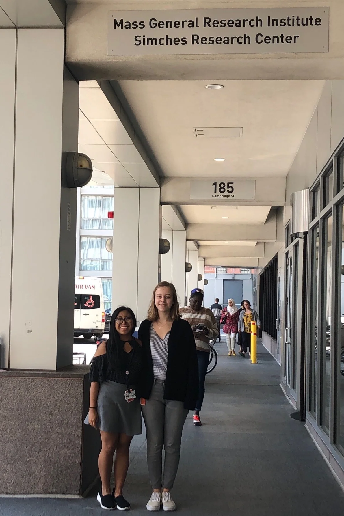 Krista (left) and Clara (right) standing in front of the Simches Research Center where they had their internship
