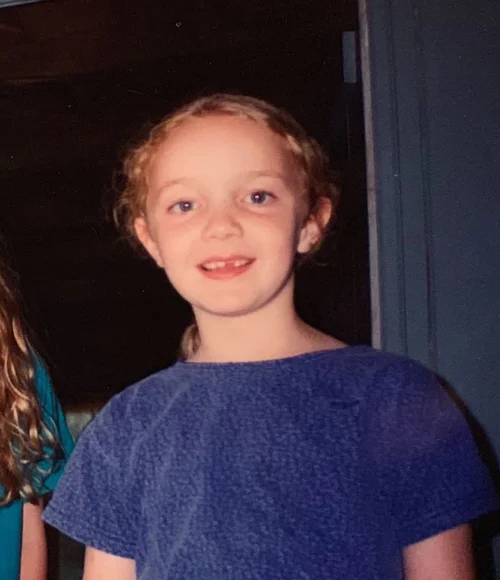 Becky missing one front tooth