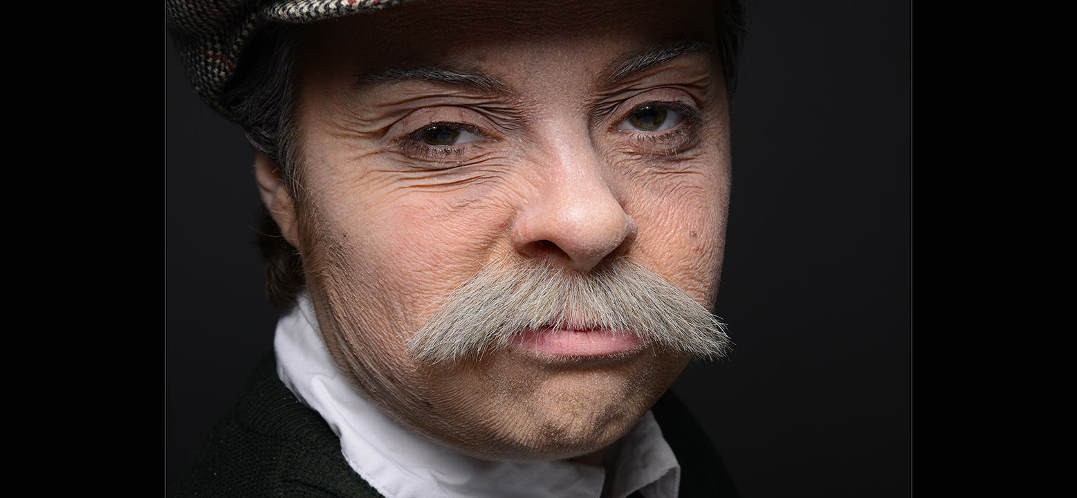Gender-swap old age make-up. Full latex stretch and stipple, silicone prosthetic nose and hand-layed mustache 