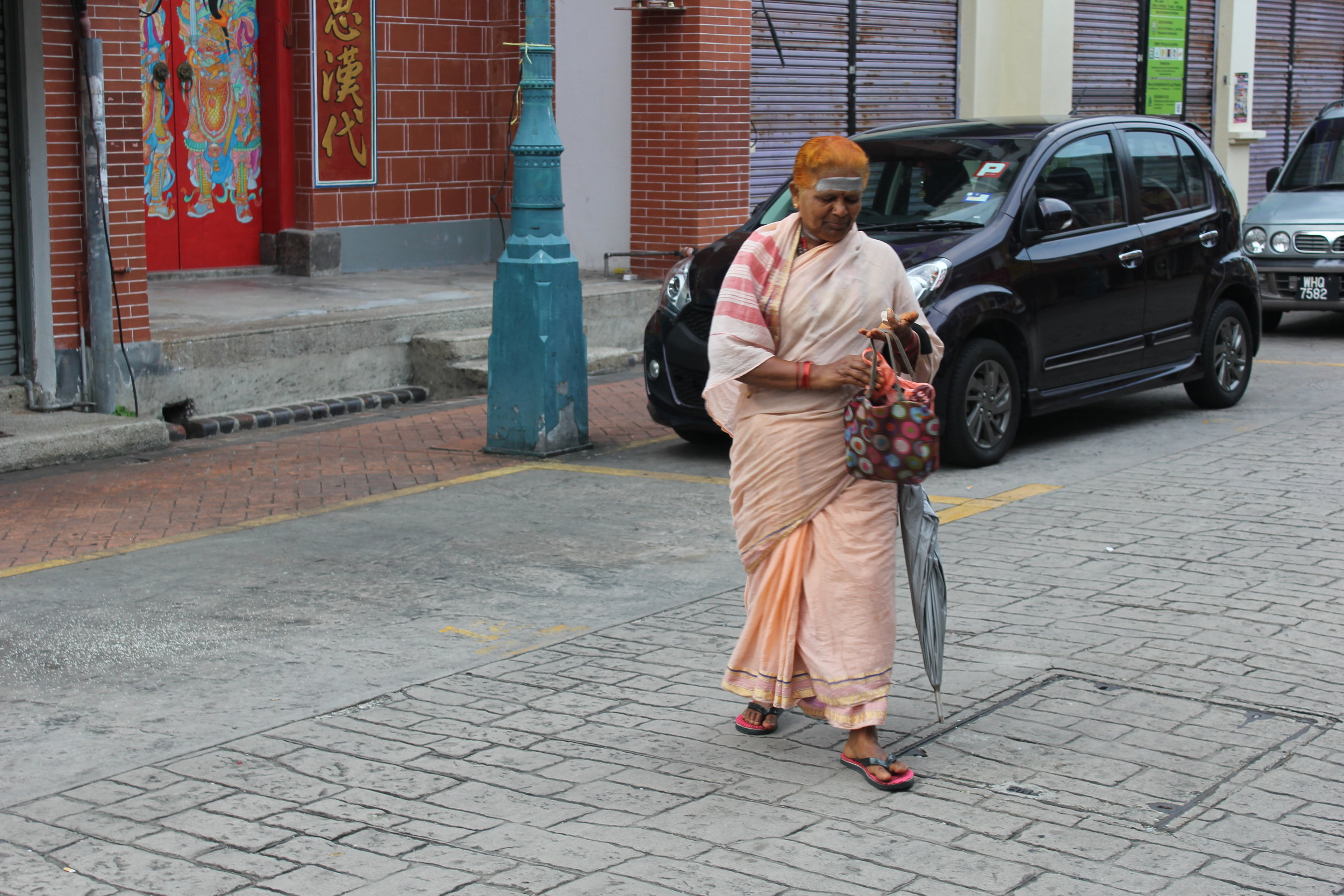 A woman walking in George Town's India Town on Penang Island, Malaysia