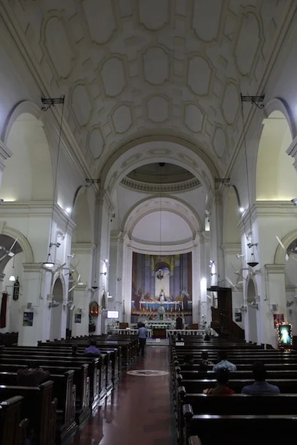 Quiet prayer inside the Cathedral of the Sacred Heart in Delhi