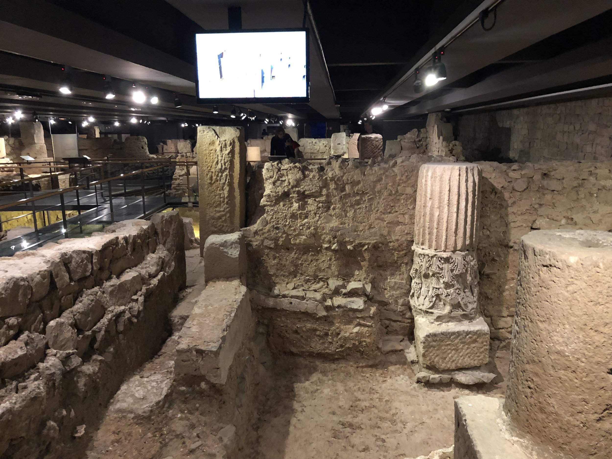 Passing through the remains of a Roman settlement and church from an earlier age of Barcelona’s long history