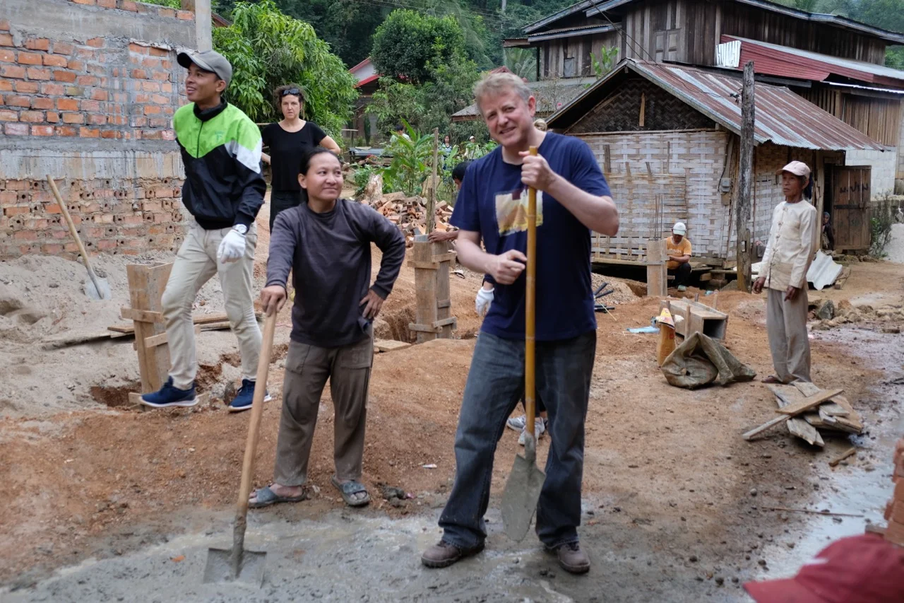 Caught loafing on the job while “chatting” in Khmu with some villagers! They were teaching me how to say “handle” and “shovel” (dam and suen as I recall).
