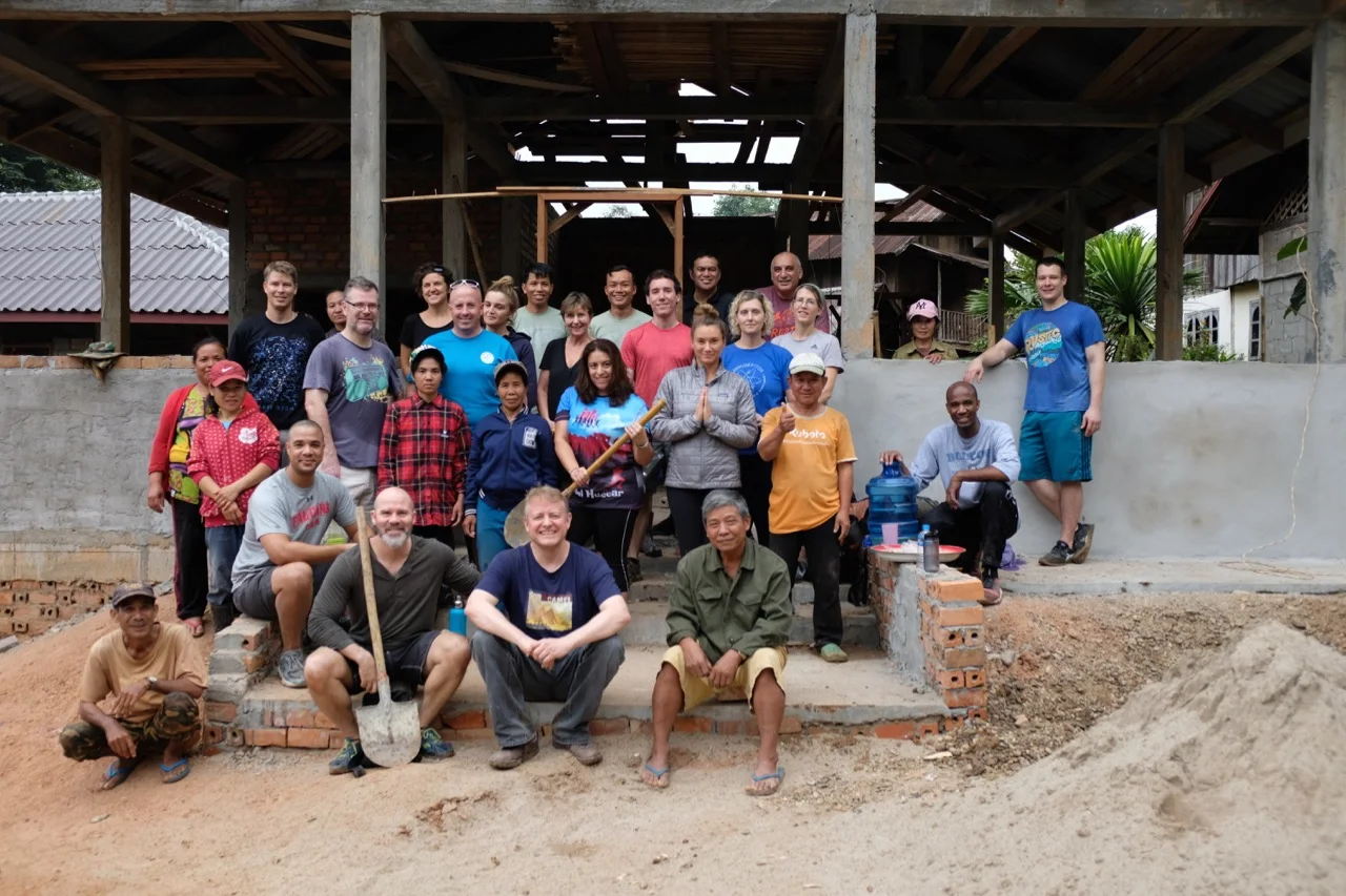 Group photo of the work crew. Behind us is the community center, which will take a while longer to complete. Each group that comes up here makes a modest contribution to it.
