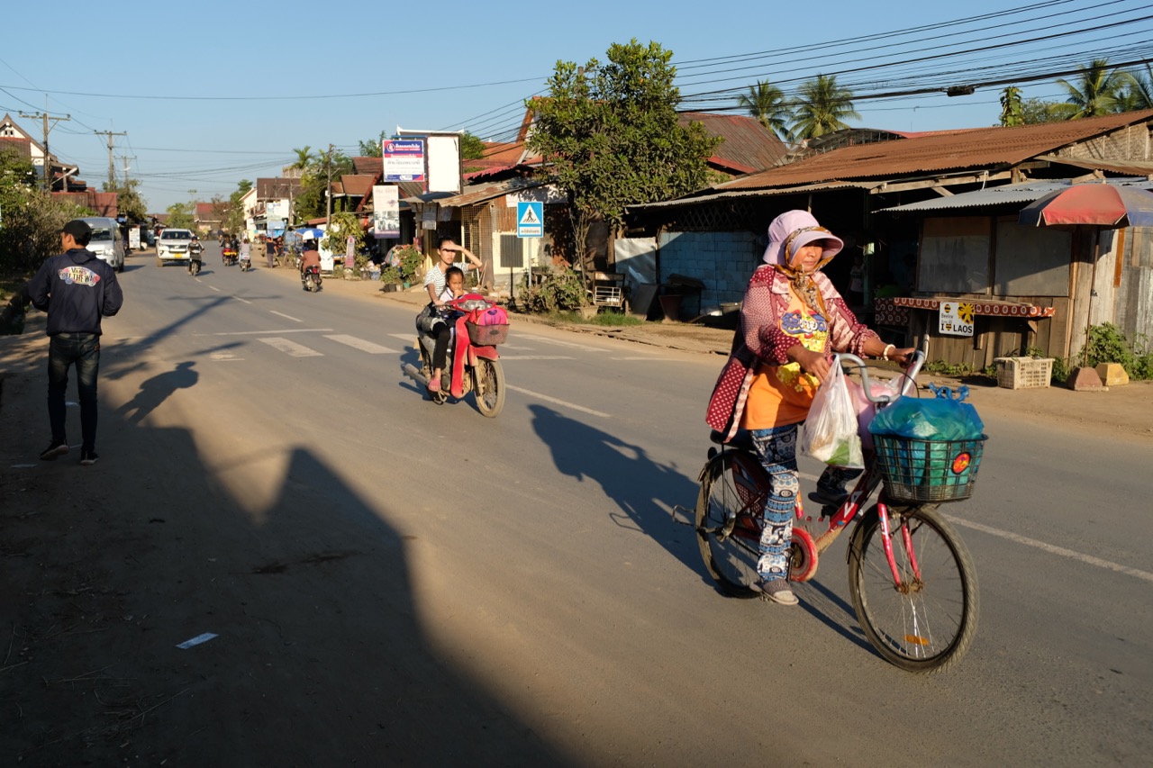 While some folks still ride bicycles to market, most seem to prefer motorbikes for getting around town.