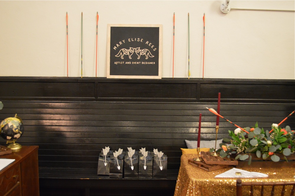 I hand painted my logo onto a piece of birch to create my booth sign and bookended it with some more vintage arrows.