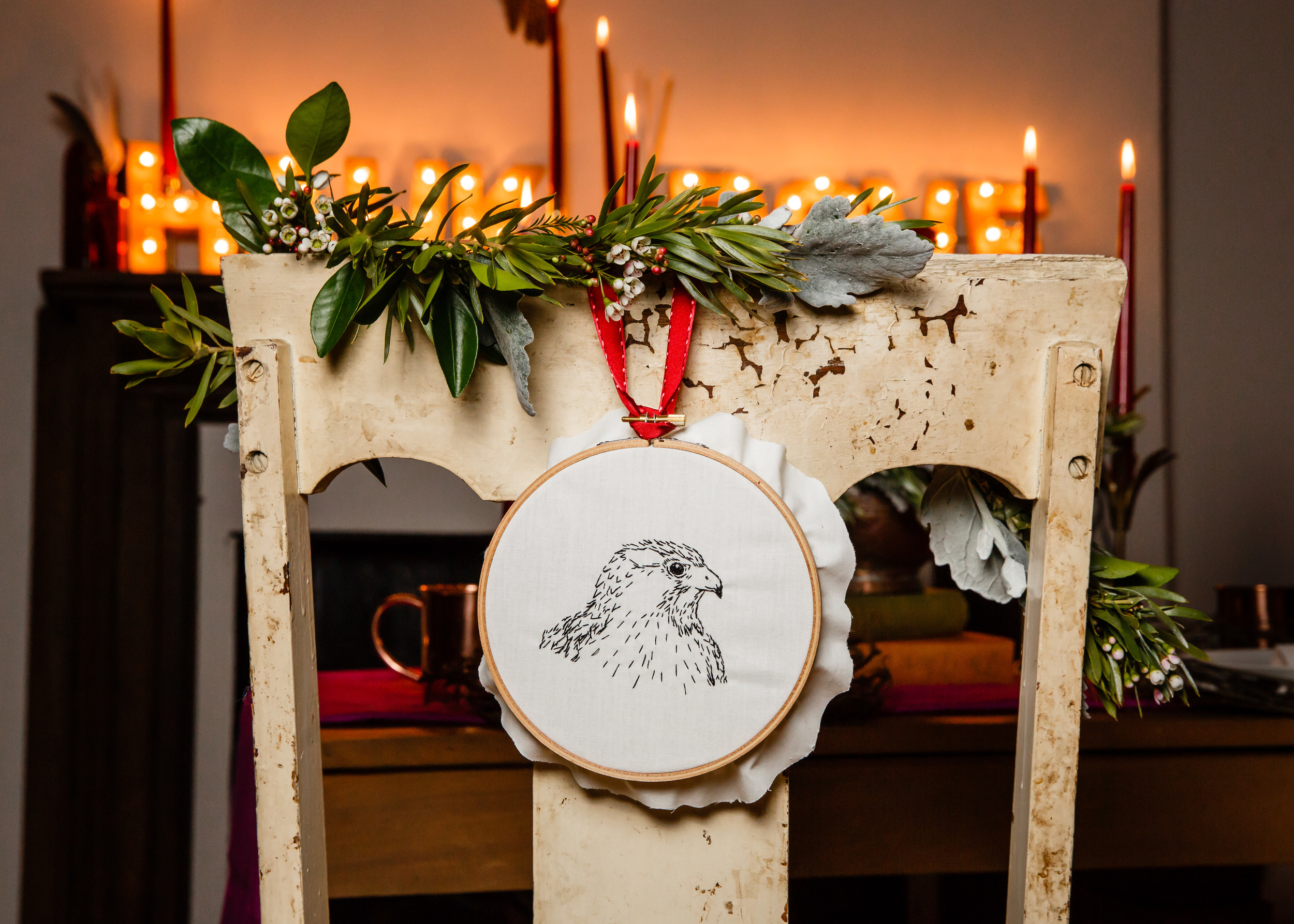I embroidered these chair back embroideries of a hawk and dove as well. The garland created by Flower Scout really paired well with them.