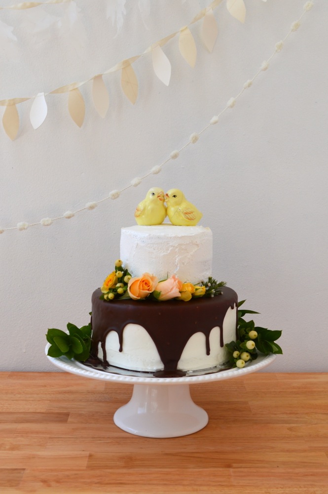 Completed cake with vintage salt and pepper shakers as topper.