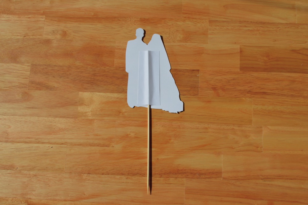 Glue down a strip of cardstock on top to sandwich the skewer in between.