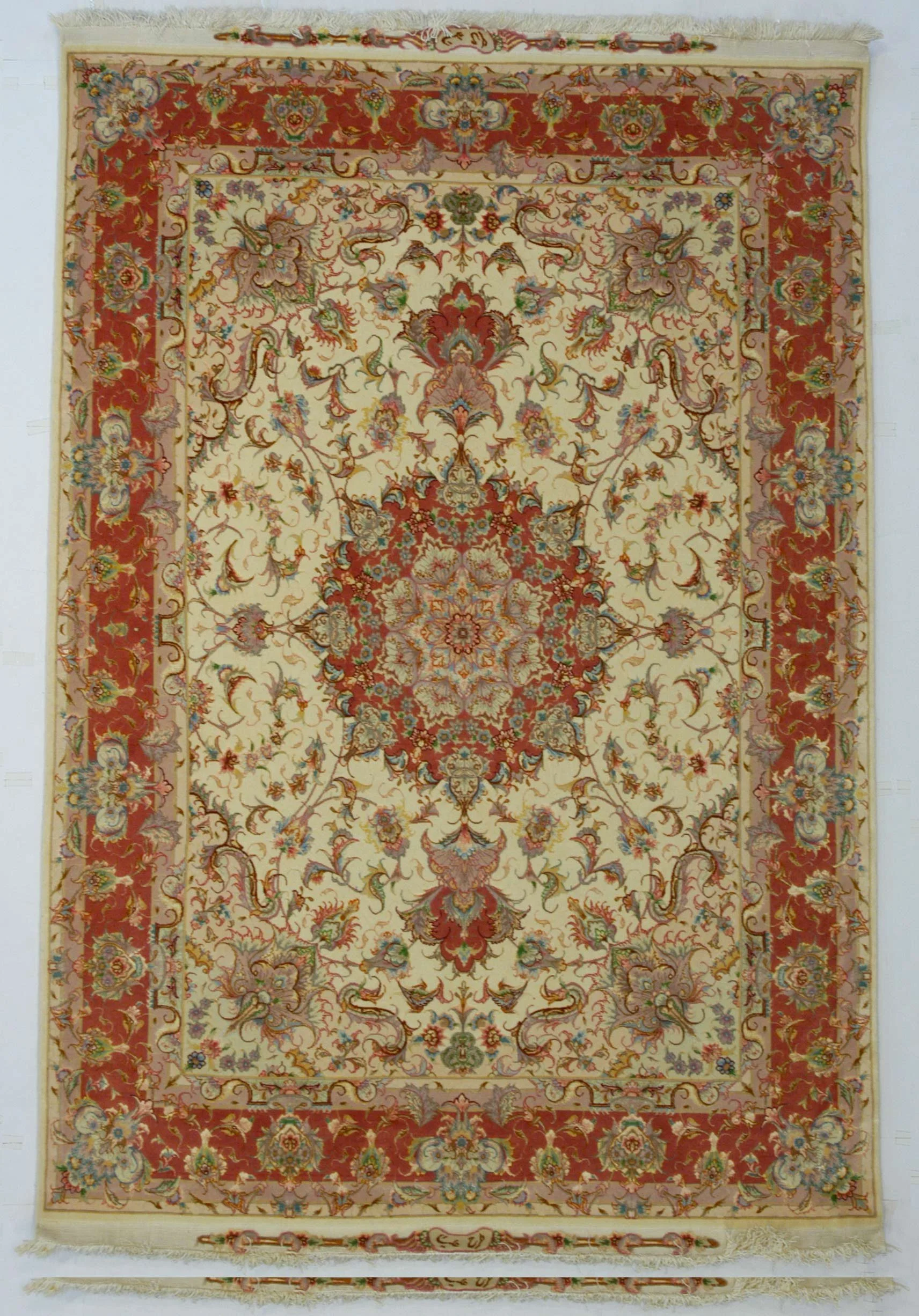 Tabriz wool and silk rug 42313, 220 × 149 cm, with a floral medallion, cream field and rust red floral border.