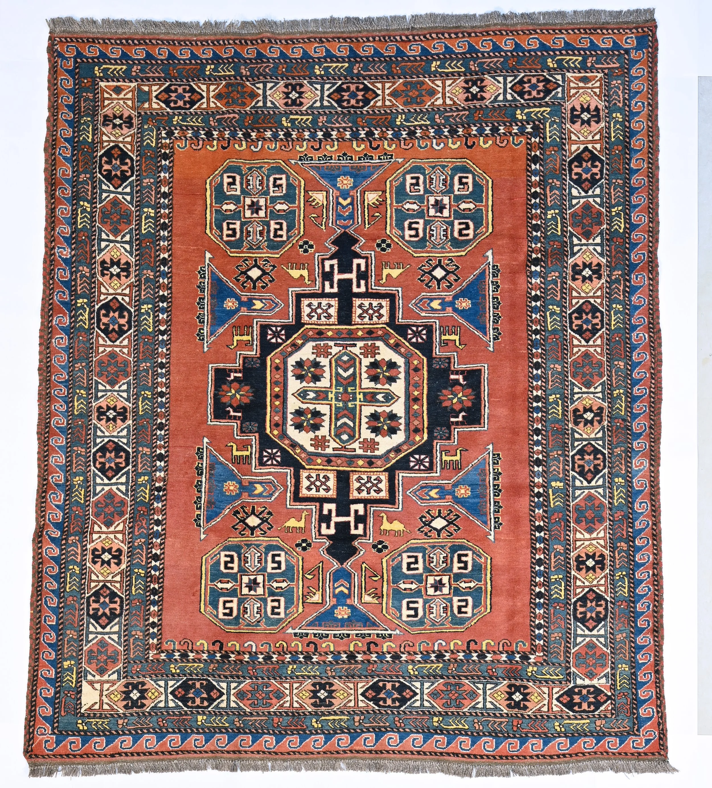 23497 182 x213cm | An Afghan rug in a Caucasian design.