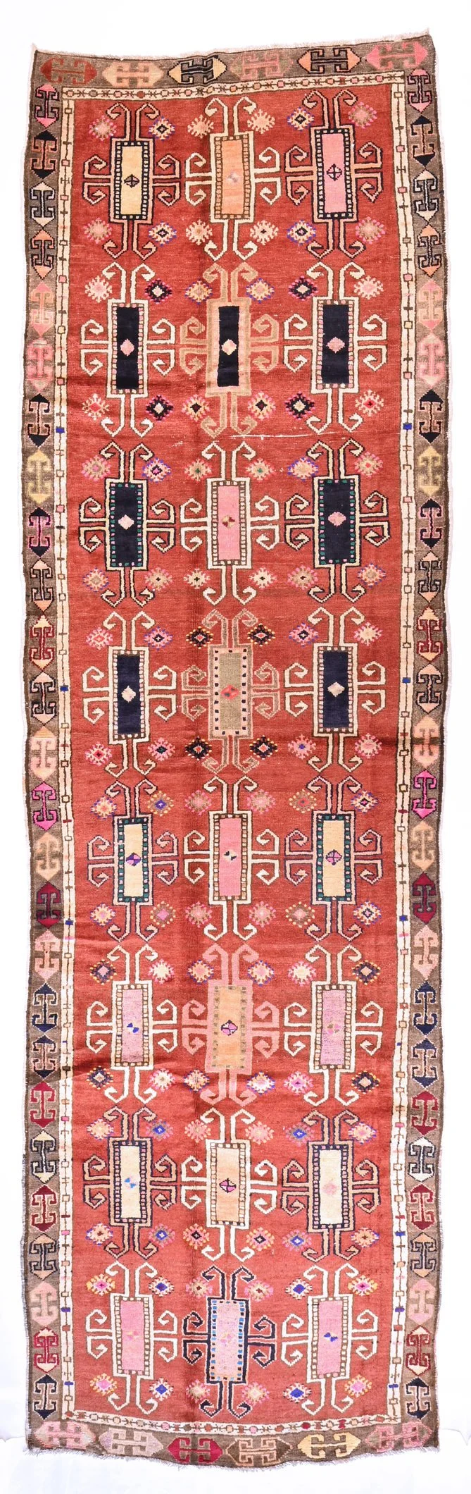 Kurdish runner 163538 from Kars with three columns of hooked motifs and bright accents on terracotta, 446 by 133 cm.
