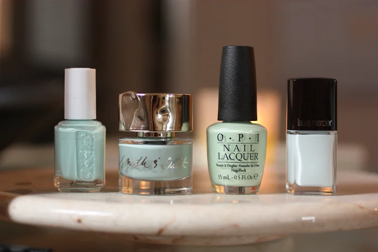 Essie Mint Candy Apple, Smith & Cult Bitter Buddhist, OPI That's Hula-rious, Laura Mercier Attitude
