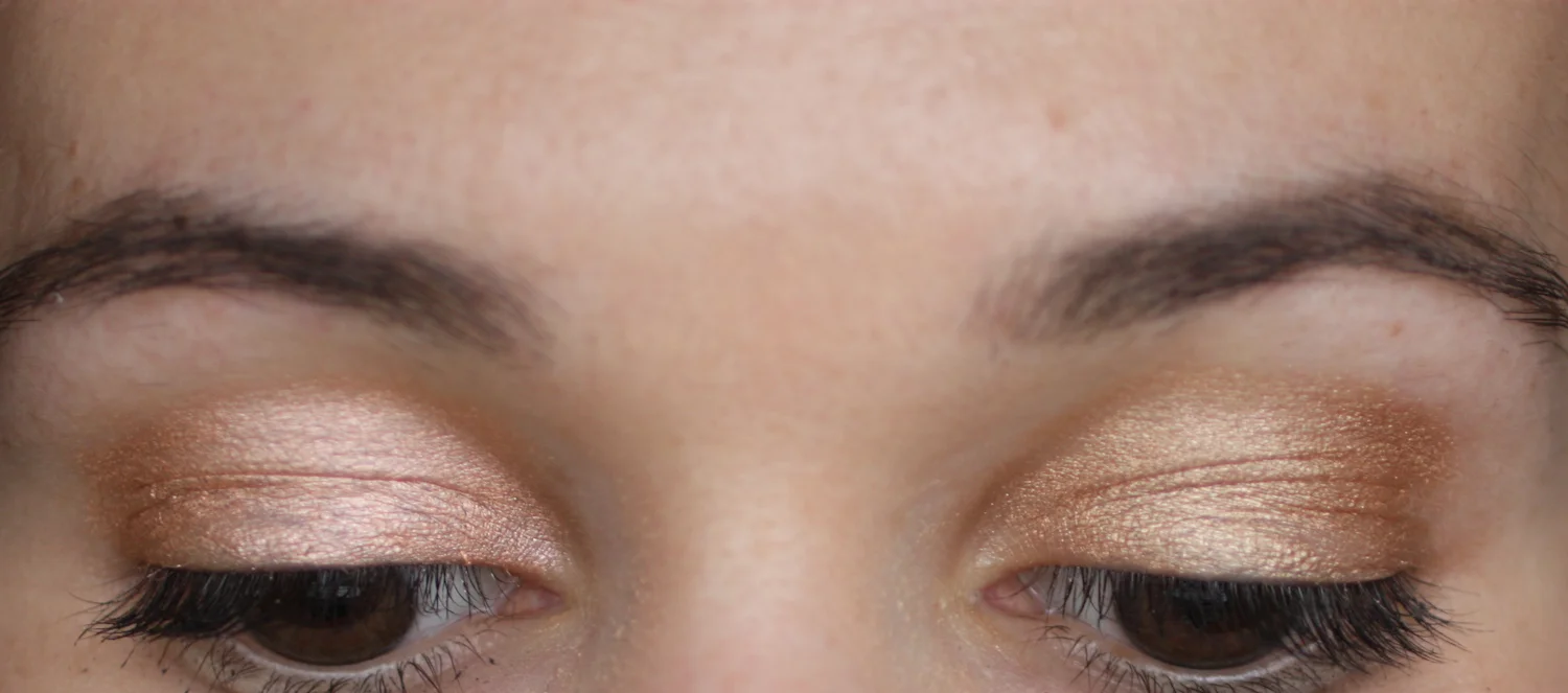 Nudestix Angel (left) and Gilt (right) swatched on eyelids