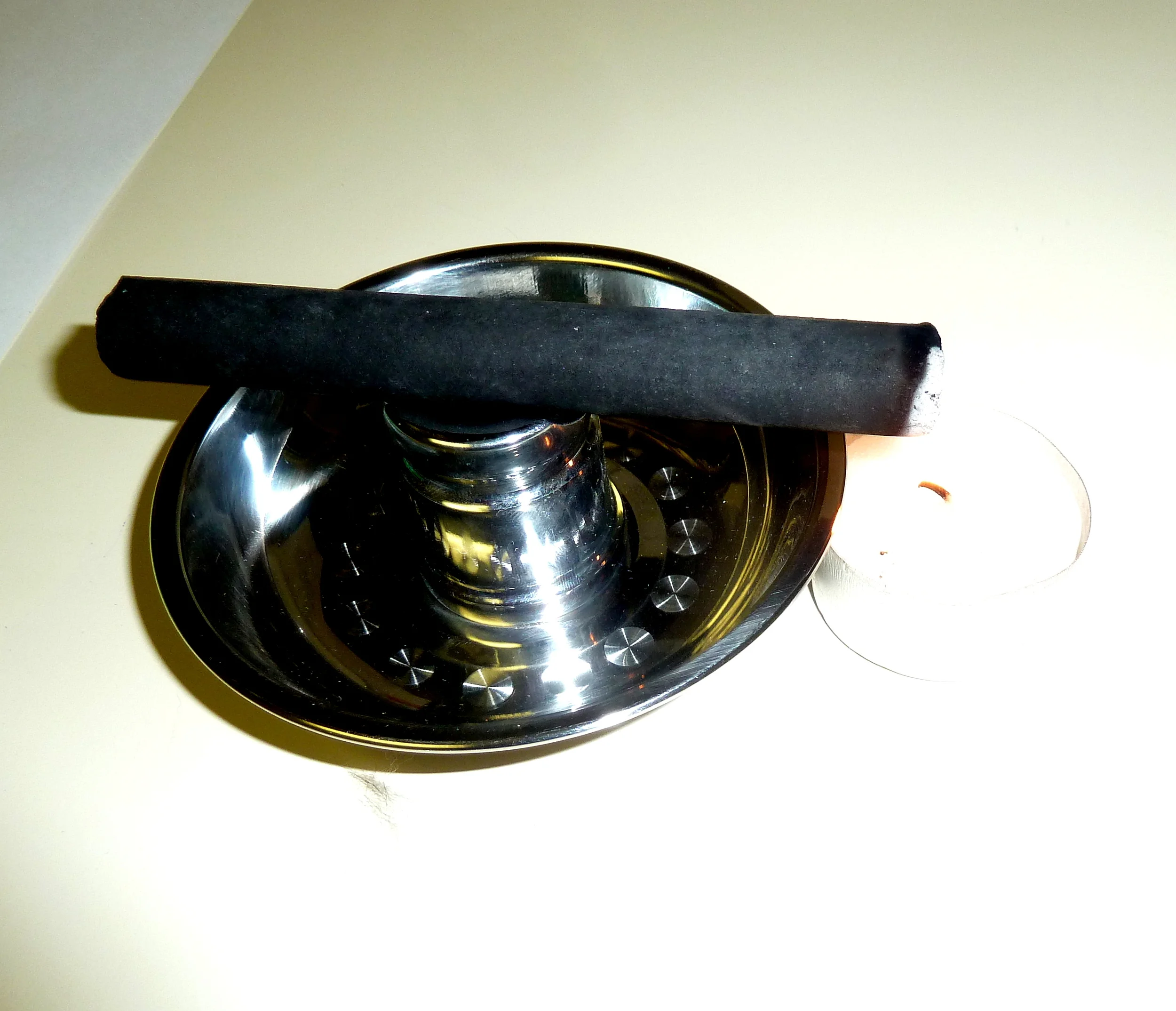 Heating the needles with moxa. 