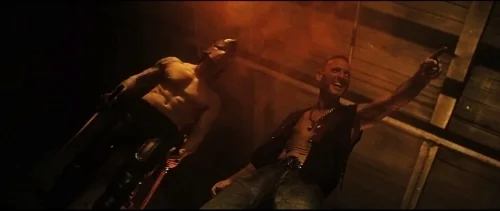 Wade Gallagher (right) as Damien Logan