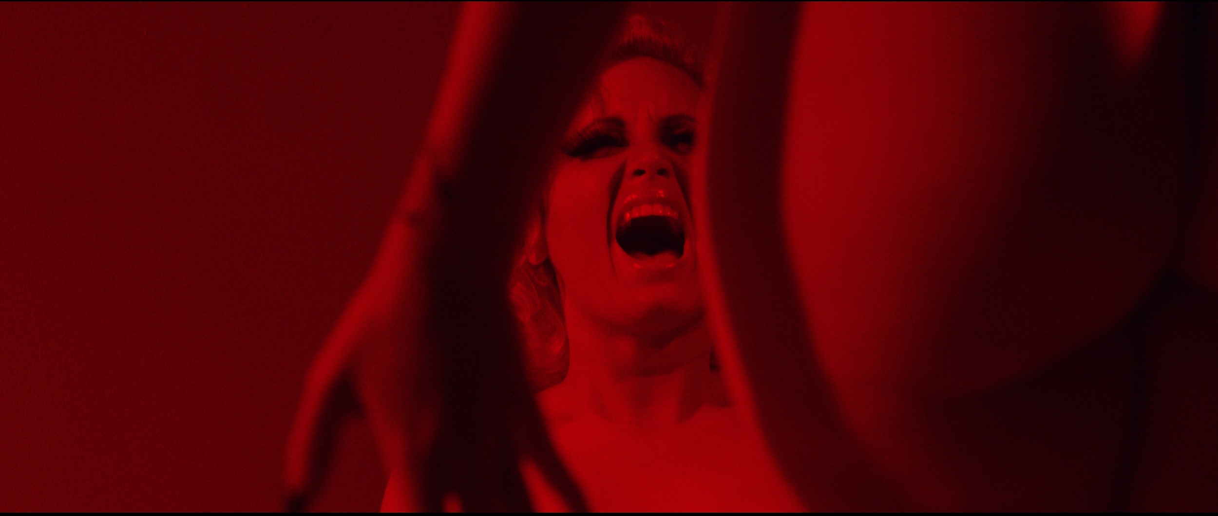 Mel in red room copy.jpg