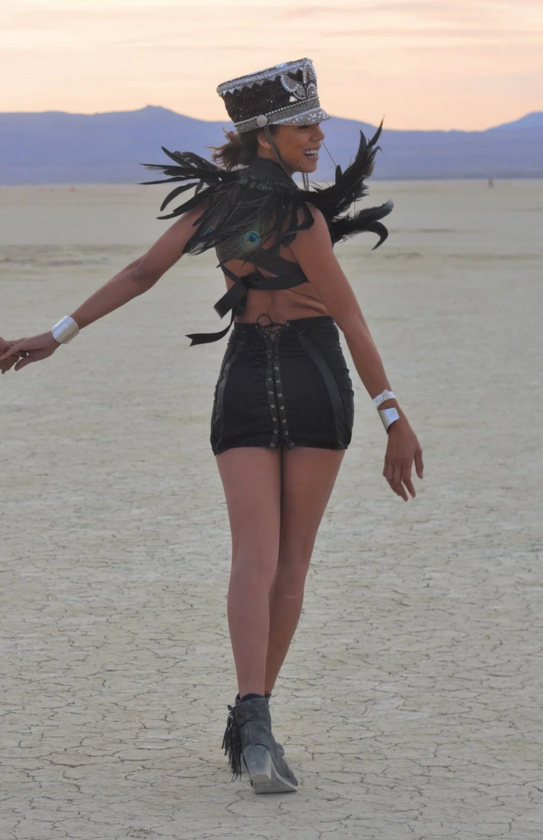 burning man inspired shoulder piece made with peacock feathers