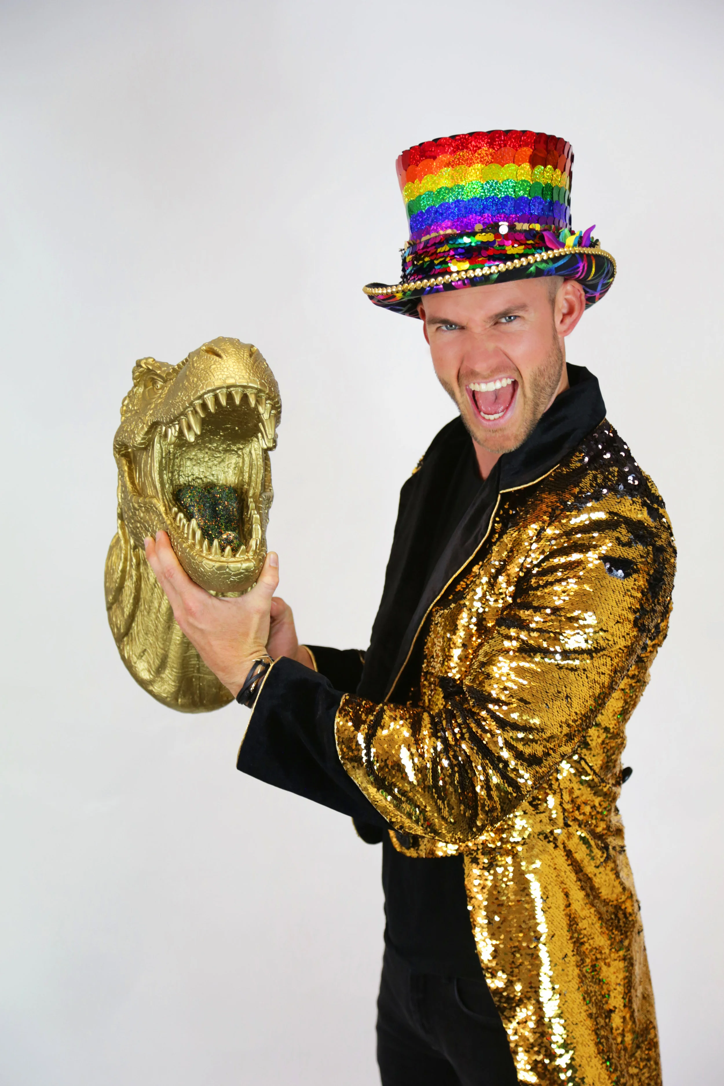 mens gold sequin jacket with velvet cuffs and a rainbow festival top hat