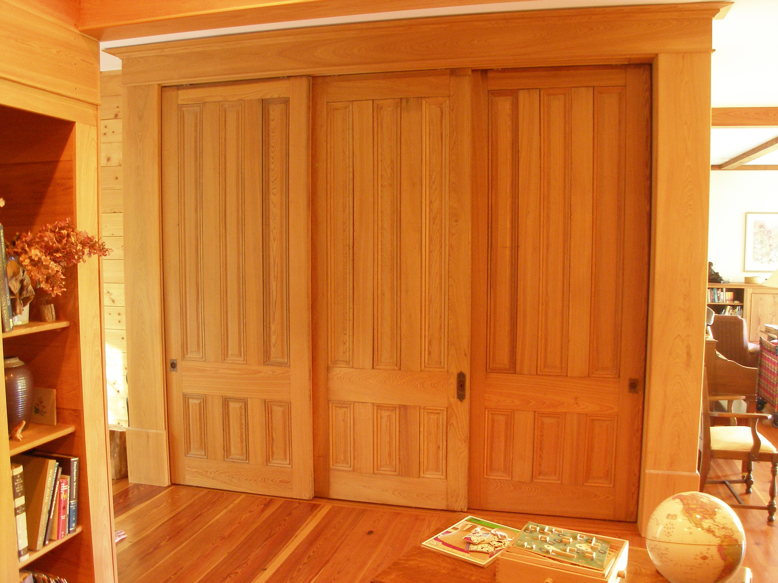 Sliding recycled, cypress doors in closed position.