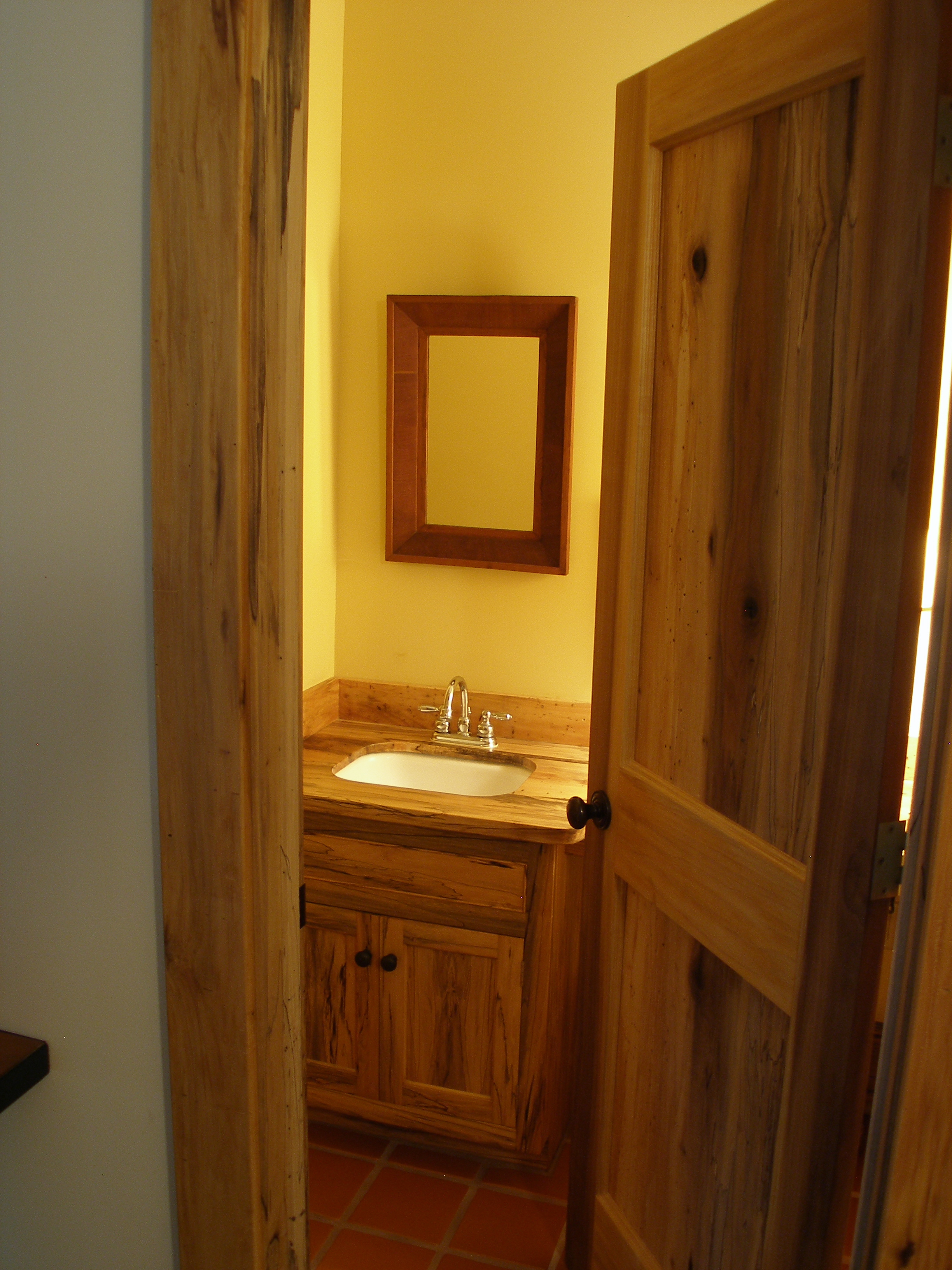 Spalted Poplar door and vanity cabinet in guest bath.
