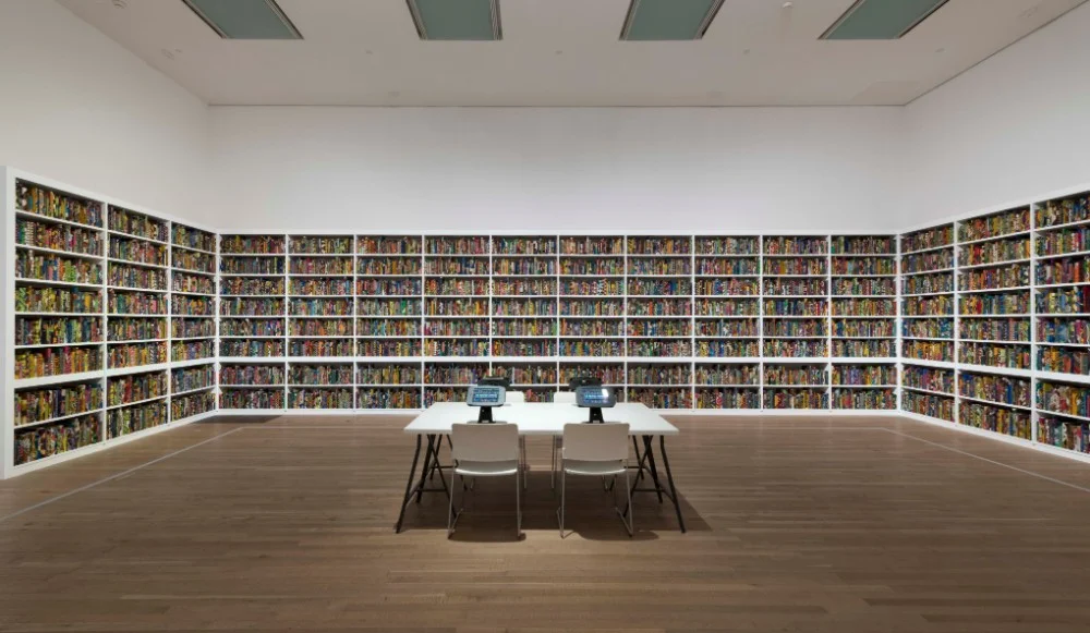 The British Library, 2014, by Yinka Shonibare, Tate Modern 2019 © Yinka Shonibare. Photograph Oliver Cowling, Tate. Purchased with Art Fund support and funds provided by the Tate International Council, the Africa Acquisitions Committee, Wendy Fisher and THE EKARD COLLECTION, 2019
