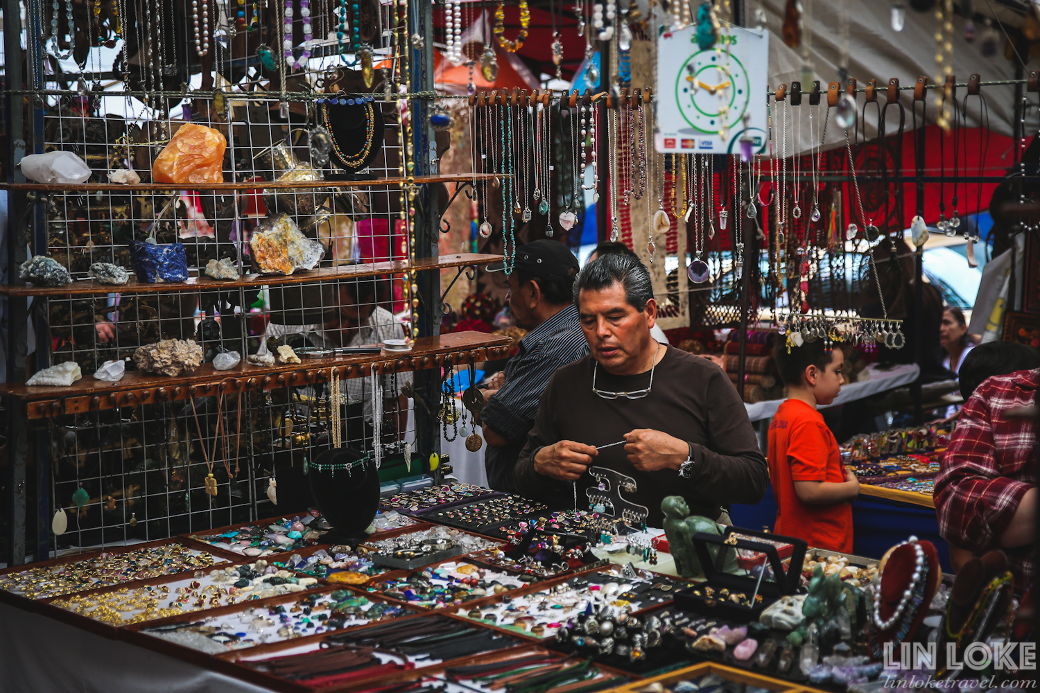 A man selling jewellery and gemstones at San Angel Bazaar