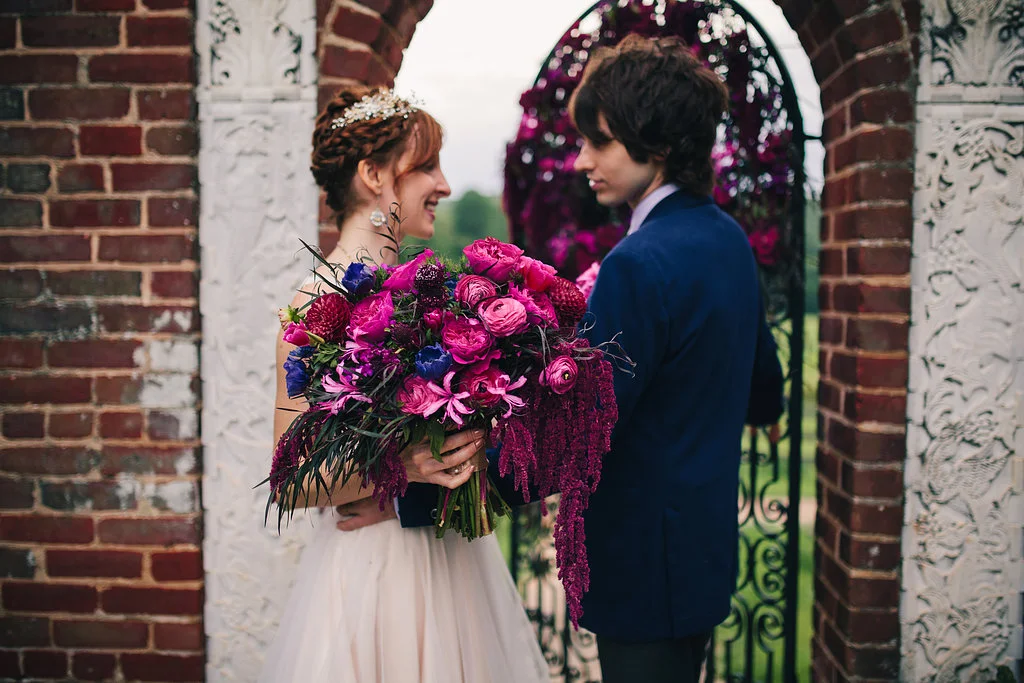 Two Spoons Photography couple beside garden arch