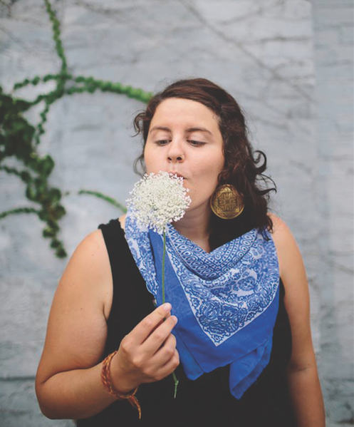 wedding photographer Rachel Joy baransi with a flower