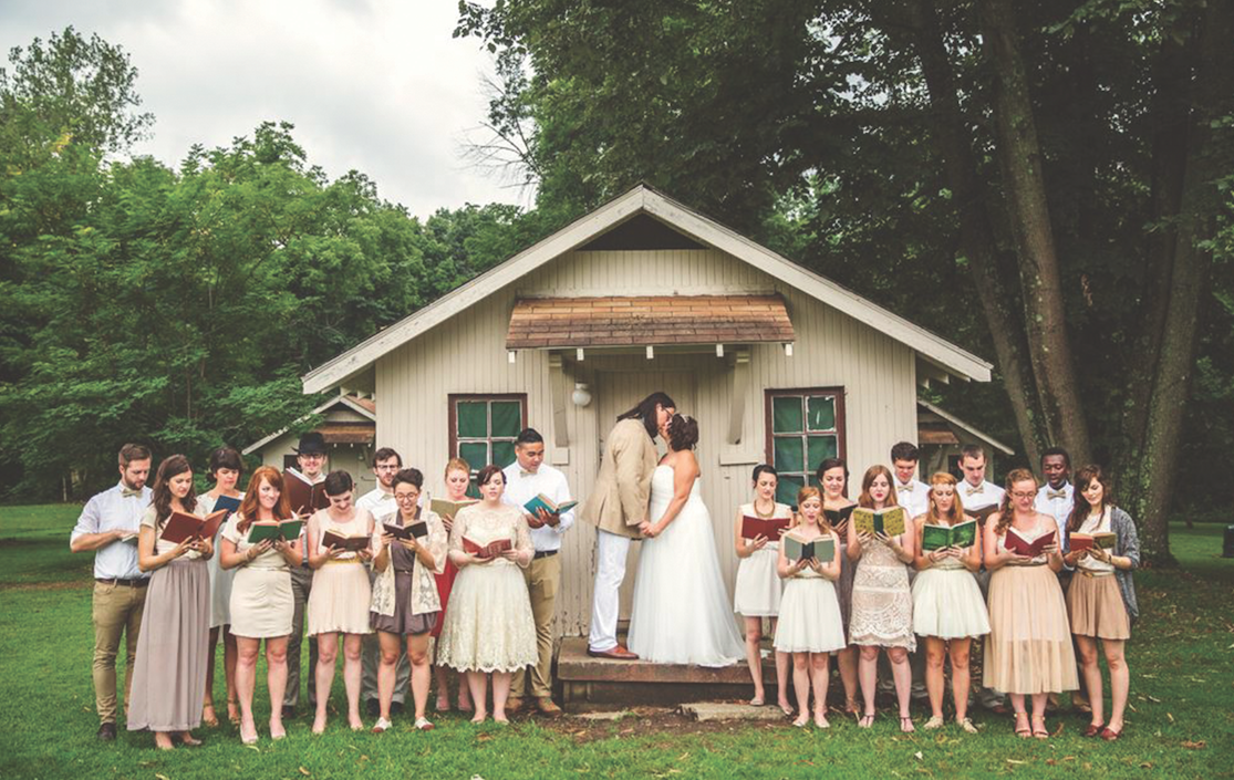 Sara Long Photography kiss surrounded by people singing
