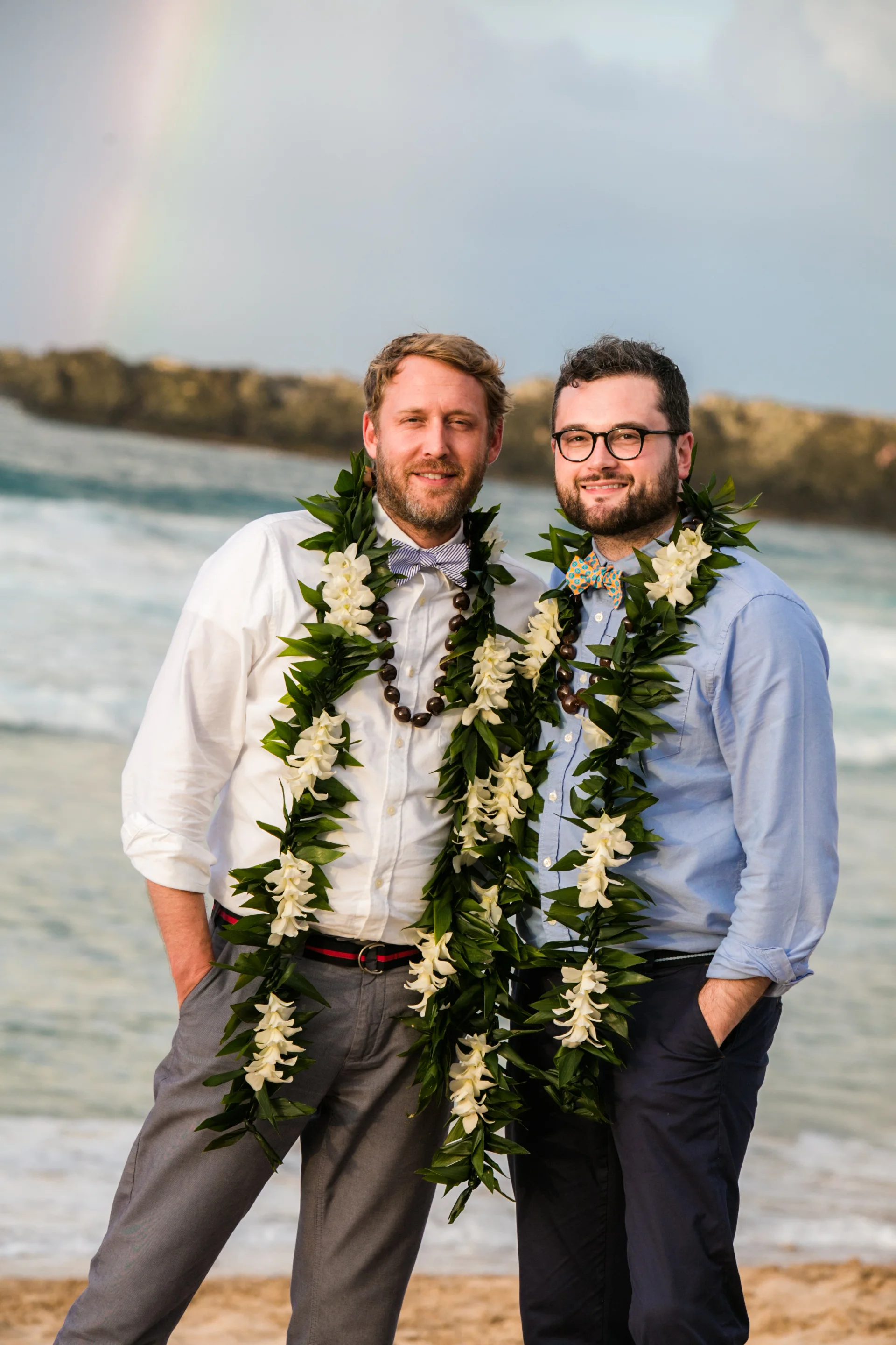 Lisa25 Wedding Photography couple by ocean with rainbow in background