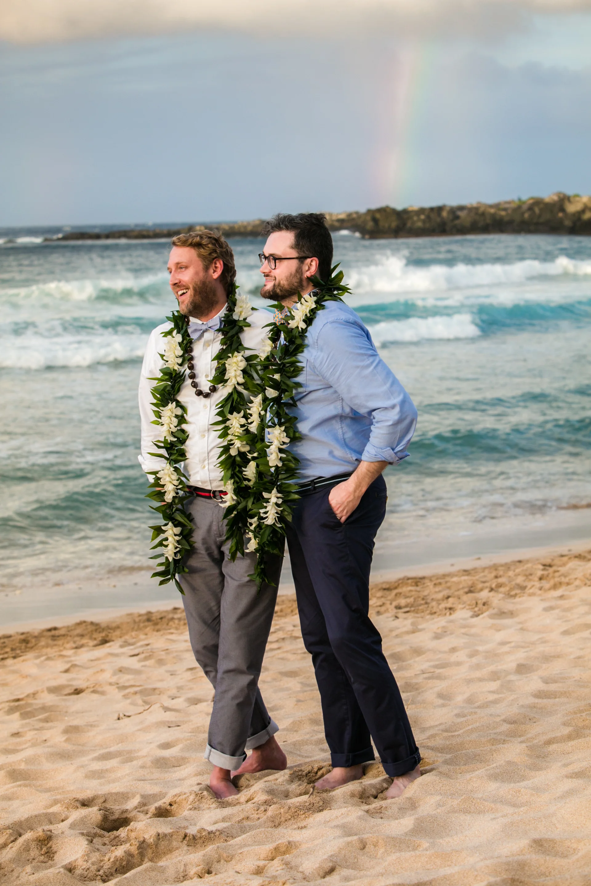 Lisa25 Wedding Photography walking on beach with rainbow in background
