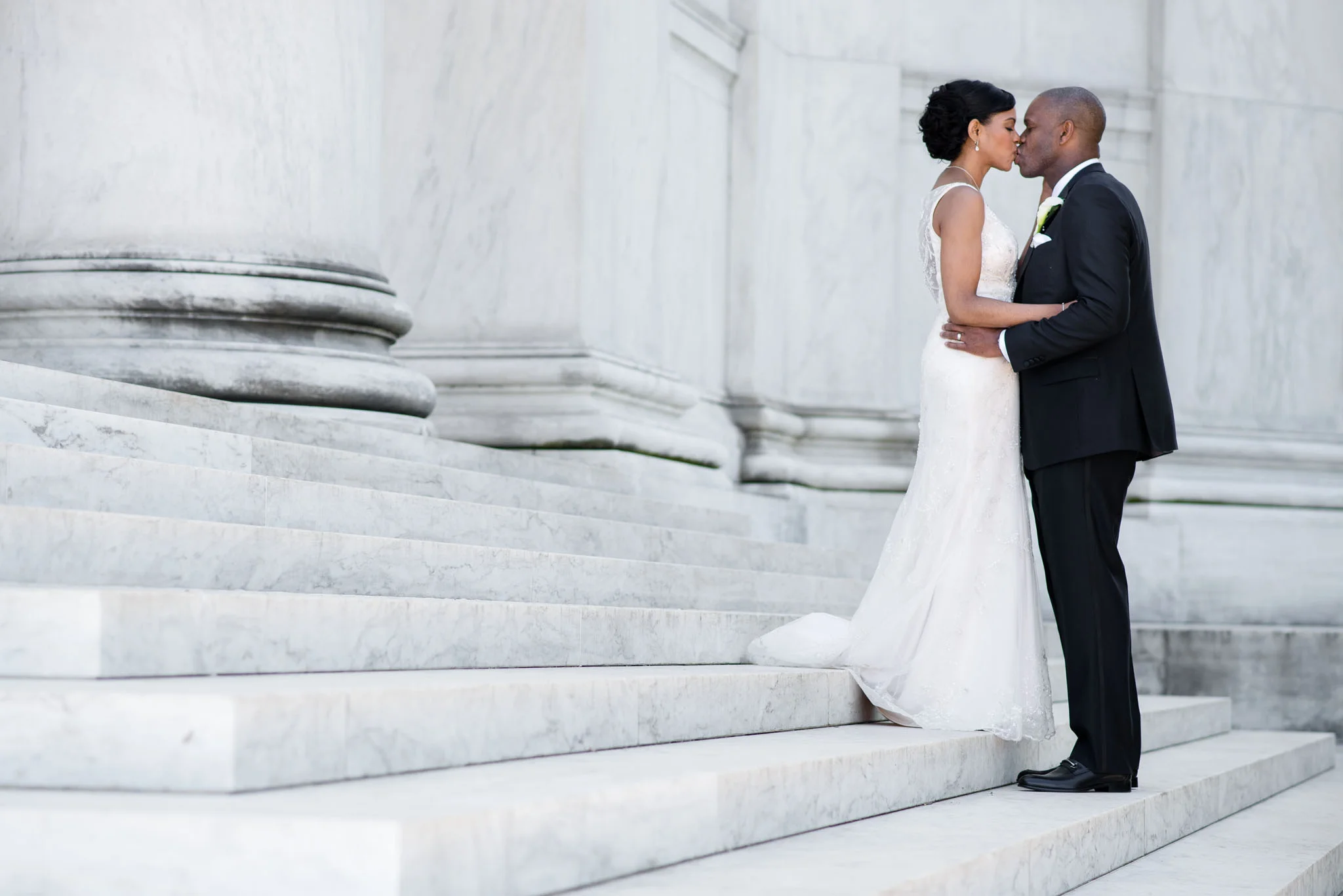 The Madious Wedding Photography DC kiss on lincoln memorial steps
