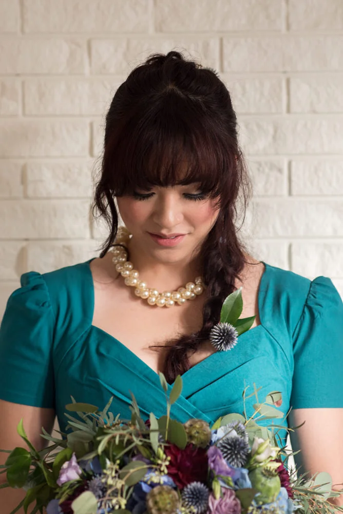 Buffy Goodman Wedding Photography bride admiring bouquet