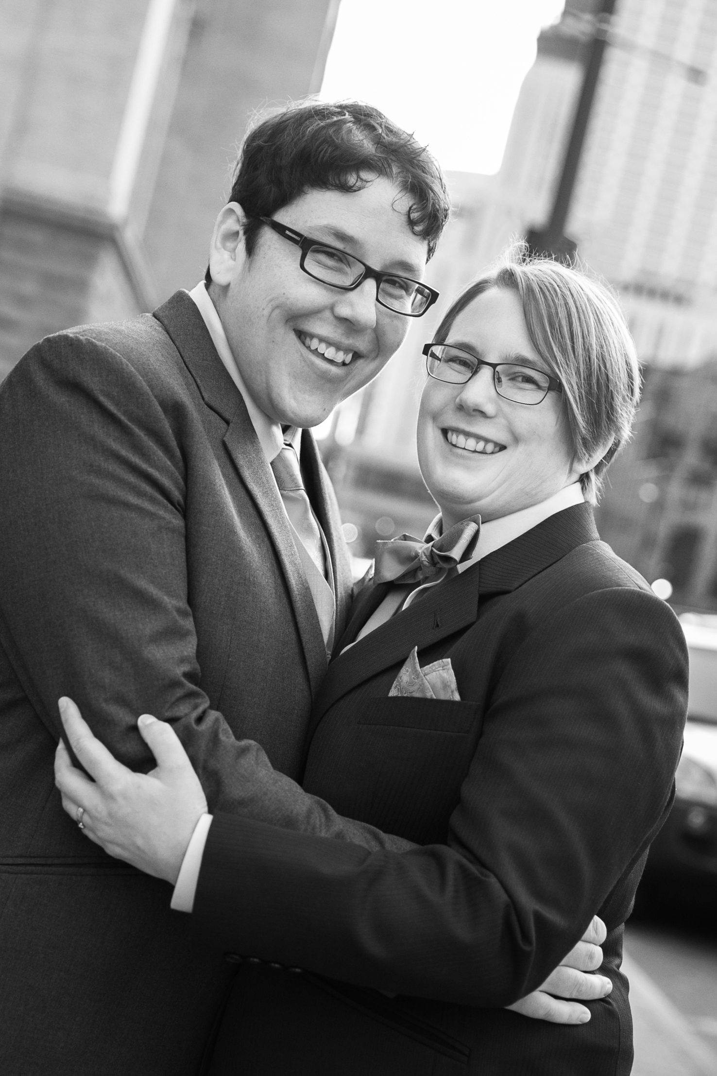 Couple gazing at camera, black and white photo