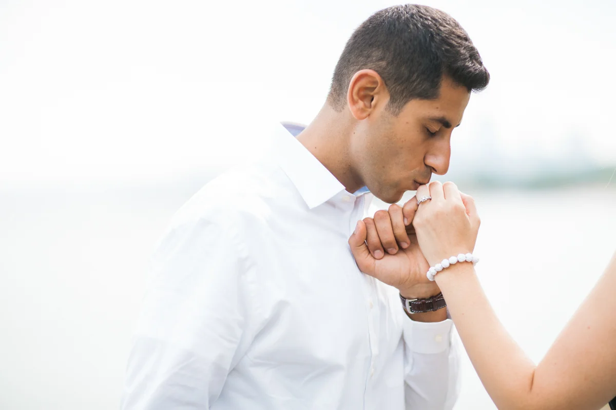 Galati Photography engagement session, groom kissing bride's hand