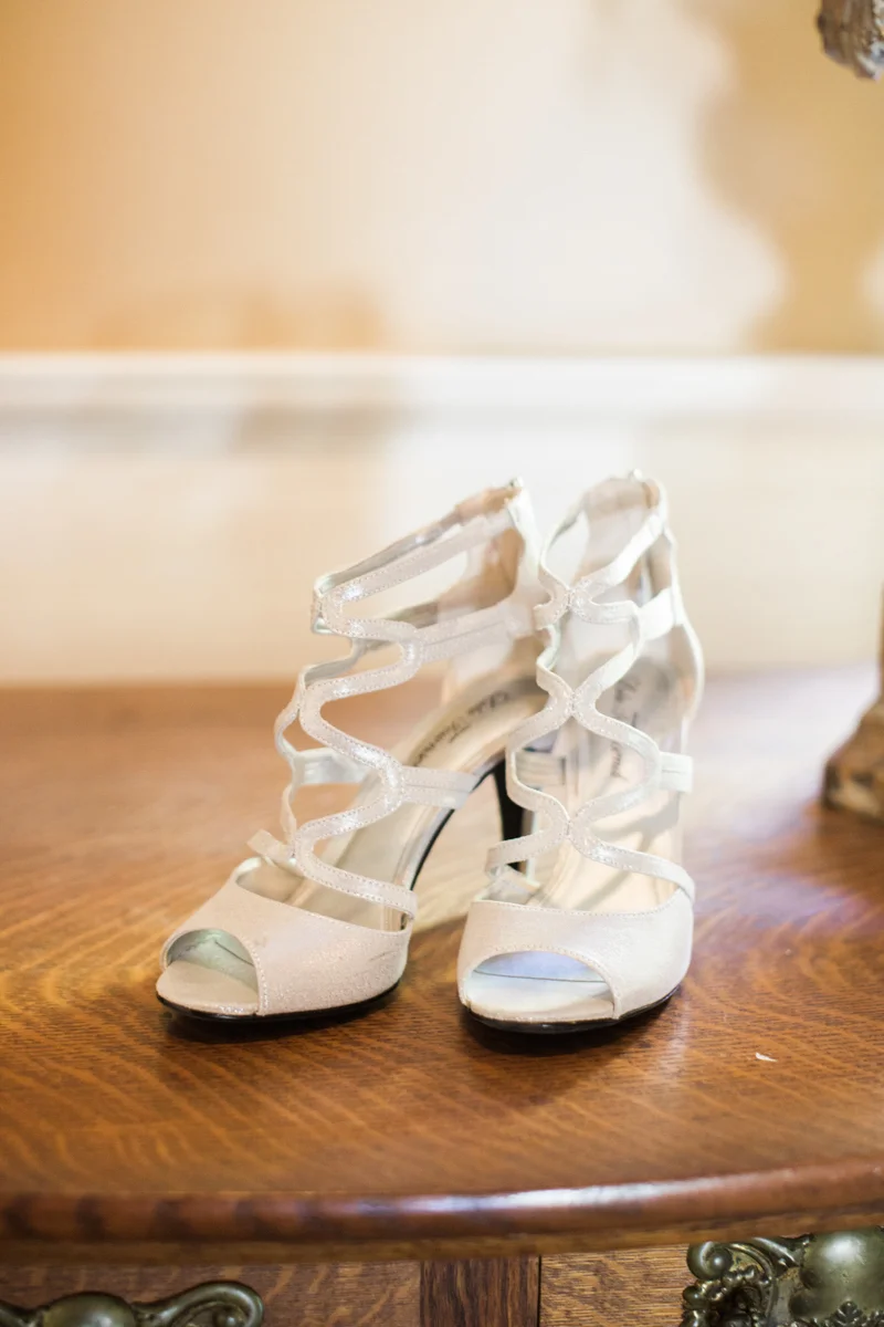bride's shoes waiting on a dresser