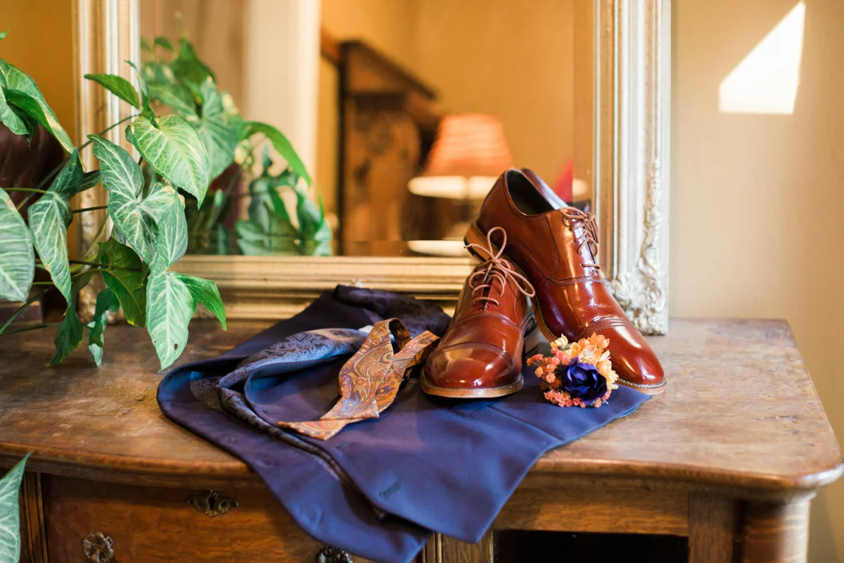 Groom's shoes on a dresser