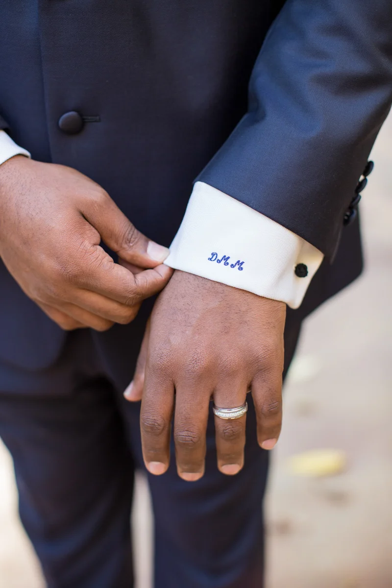 Monogrammed cuff on groom's shirt