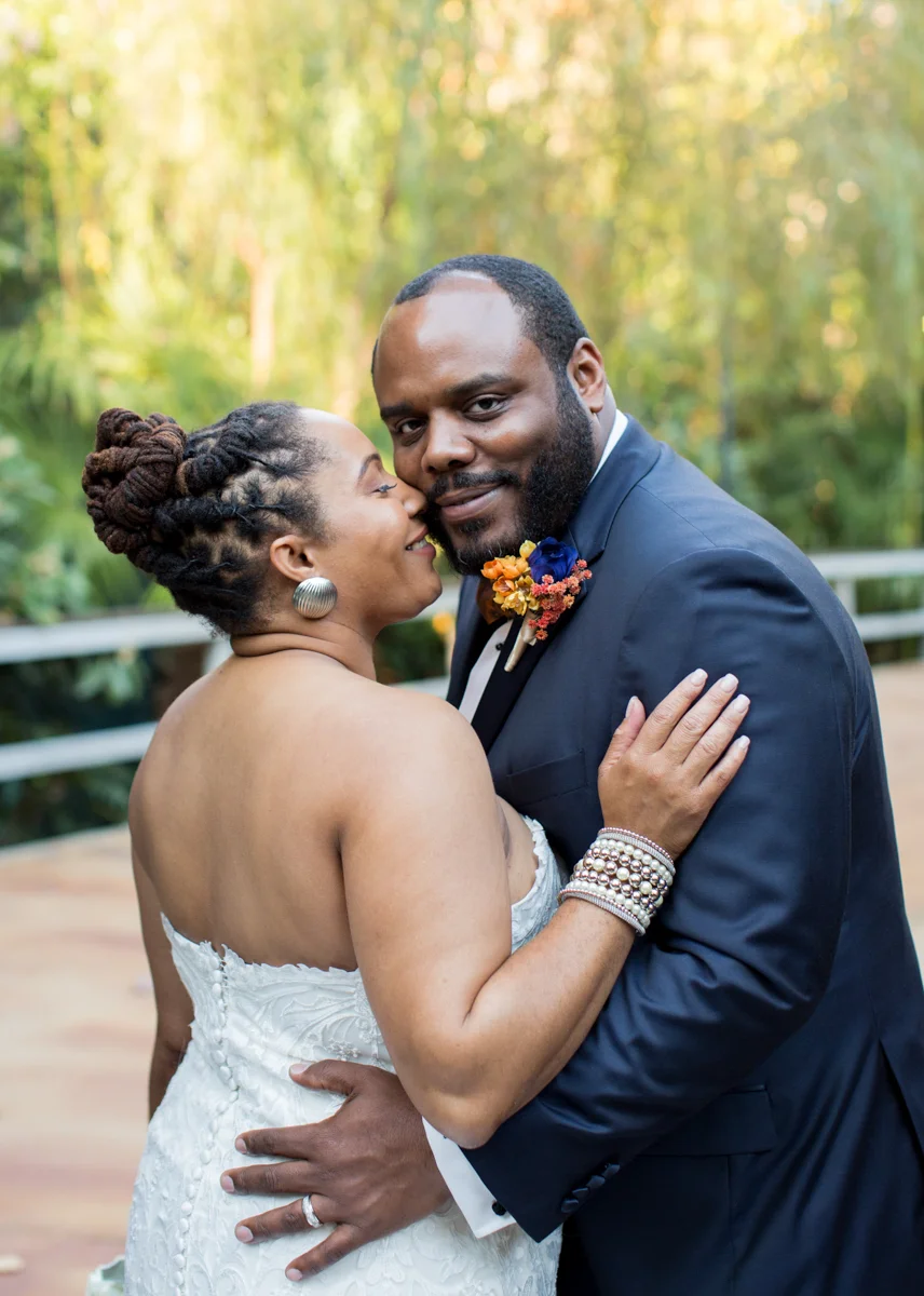 bride kissing groom's cheek