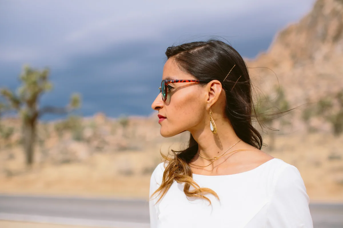 Hip bride in sunglasses in the desert