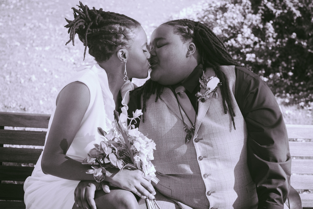 LGBTQ newlywed couple kissing on a park bench Richmond Virginia Toronto Ontario Canada Hidden Exposure Photography