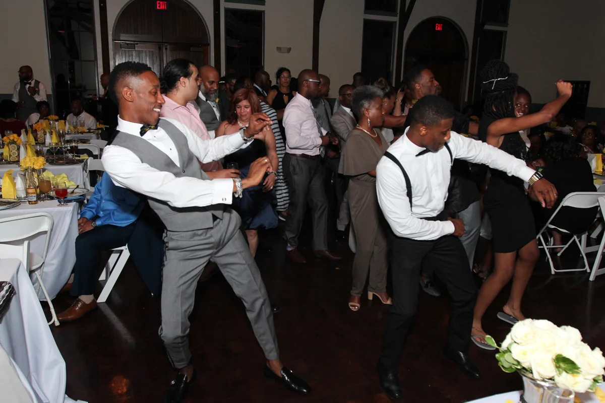 Grooms dancing at their wedding reception.