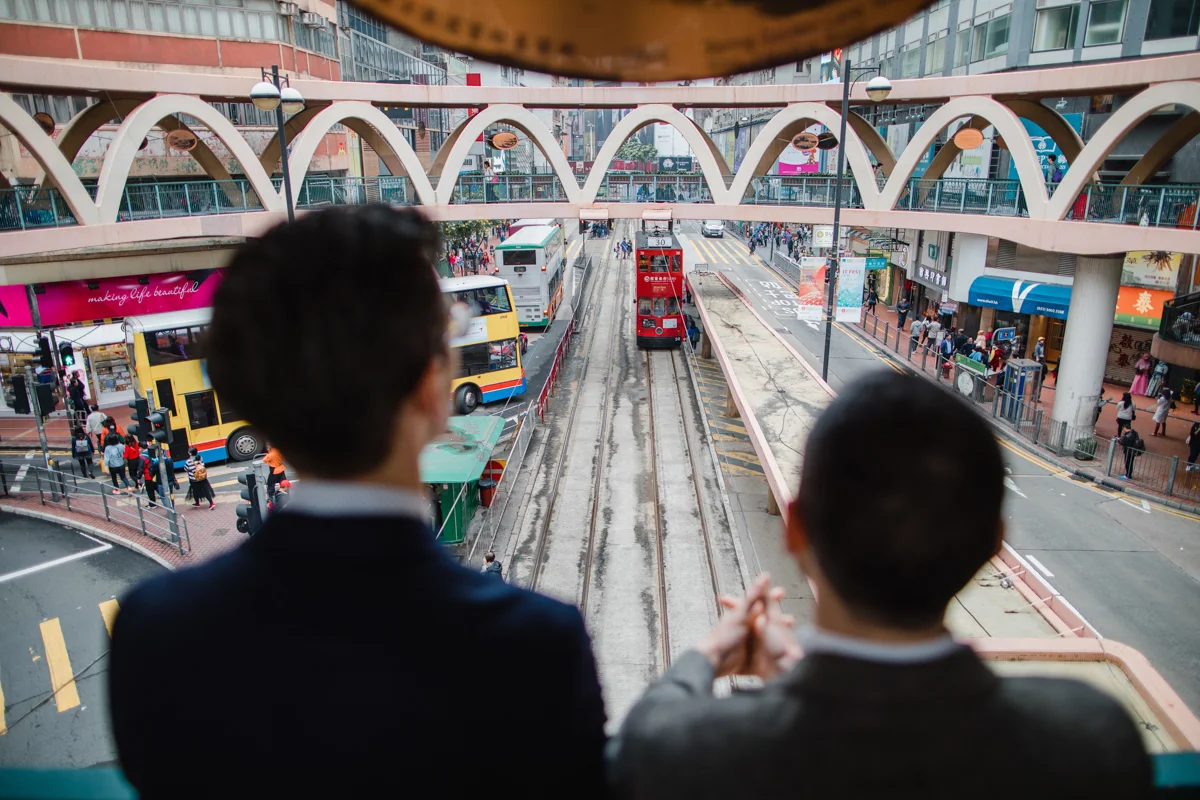 couple looking at the rail yards of Hong Kong