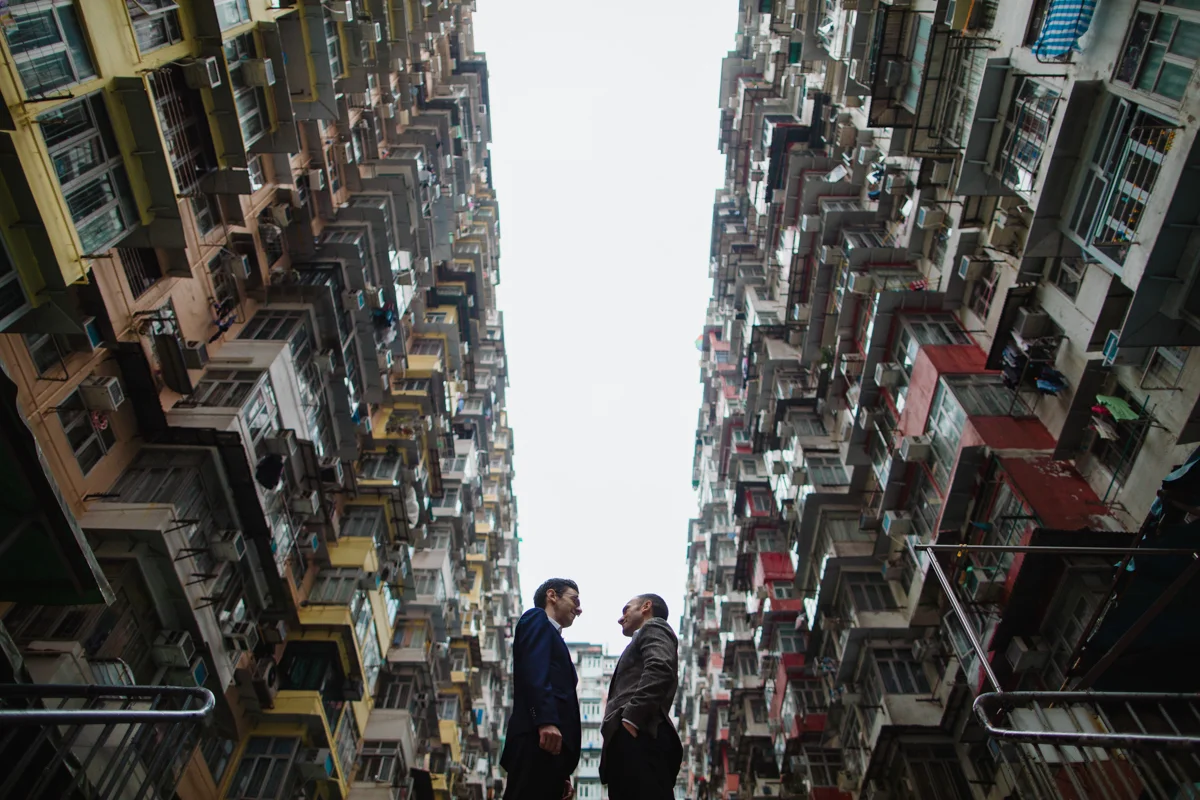apartment buildings of Hong Kong with the couple centered